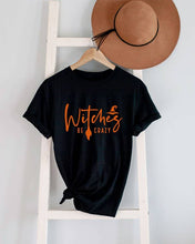 Load image into Gallery viewer, Witches be crazy, Halloween, Unisex Round Neck T-Shirt: Black/Orange / S
